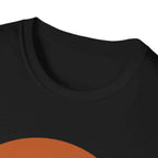 Close-up of a black t-shirt with an orange graphic on the lower portion.