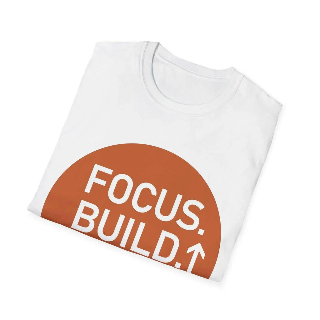 Folded white T-shirt with a terracotta colored circle printed on the front, bearing the text "FOCUS. BUILD." with an upward pointing arrow.