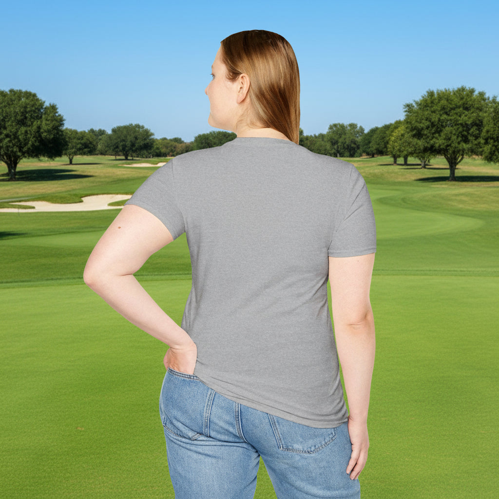 Person wearing a gray t-shirt and blue jeans on a golf course.