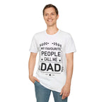 A man in a white t-shirt with the text "My Favourite People Call Me Dad" and blue jeans.