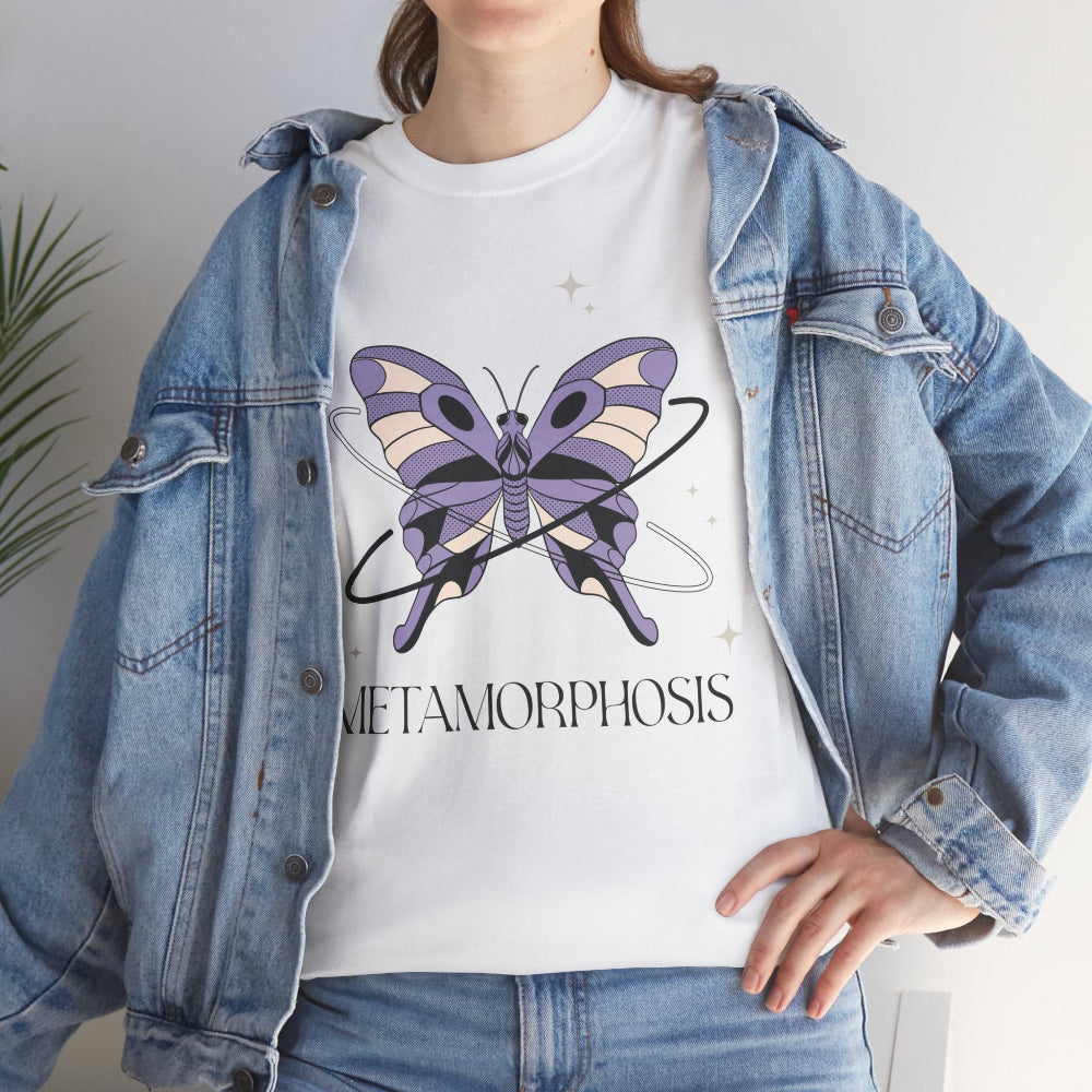 Person wearing a white t-shirt with a butterfly graphic and 'Metamorphosis' text, paired with a denim jacket.