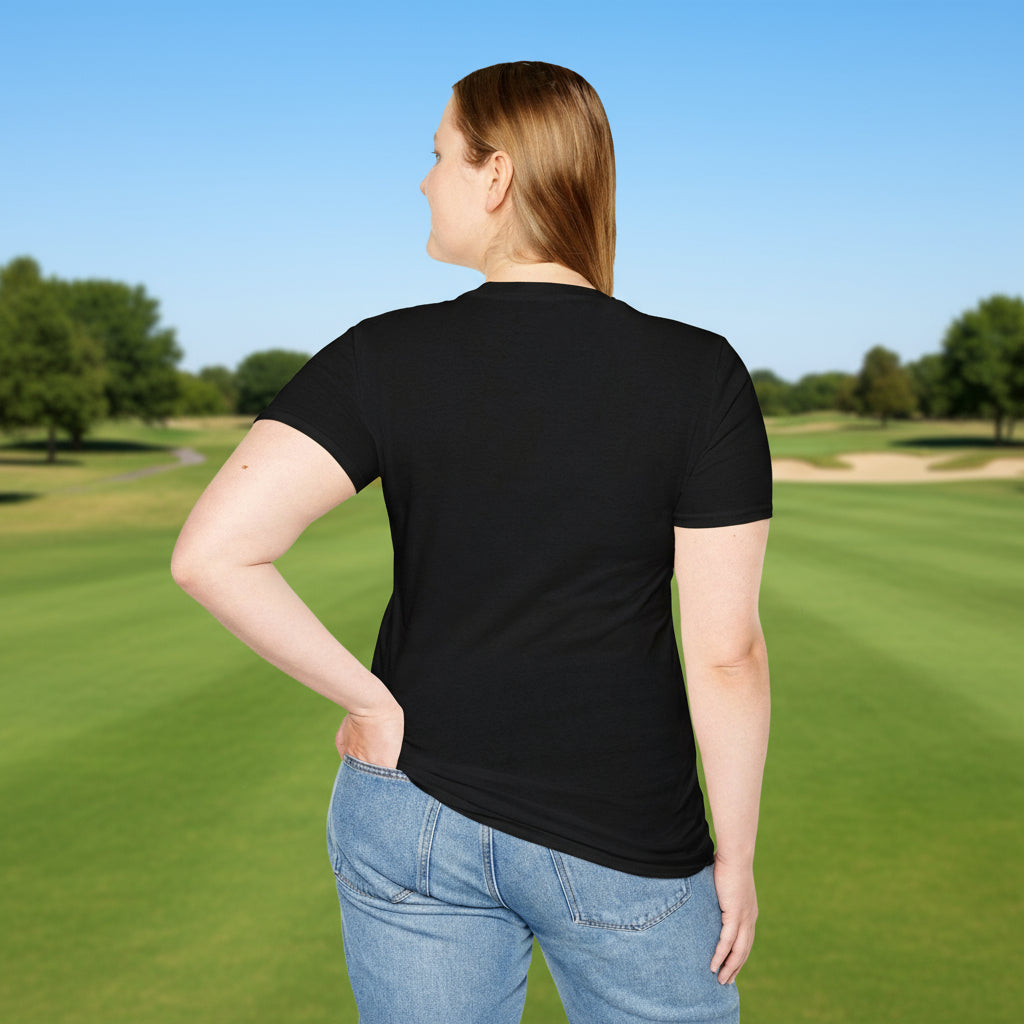 Person wearing a black t-shirt and blue jeans on a golf course.