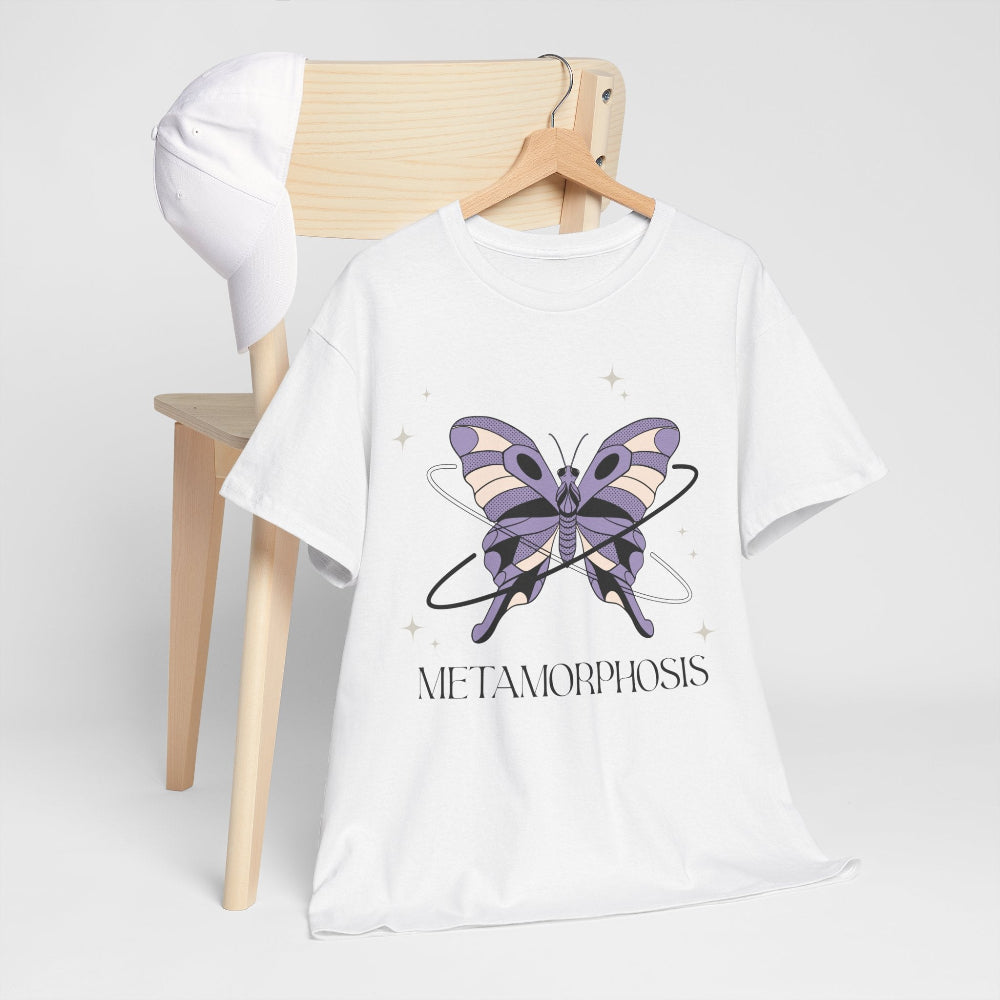 White t-shirt with a butterfly graphic and 'Metamorphosis' text on a wooden chair.